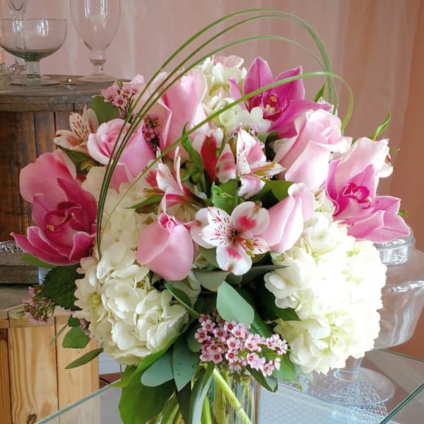 Pink and white mixed bouquet in a clear glass vase