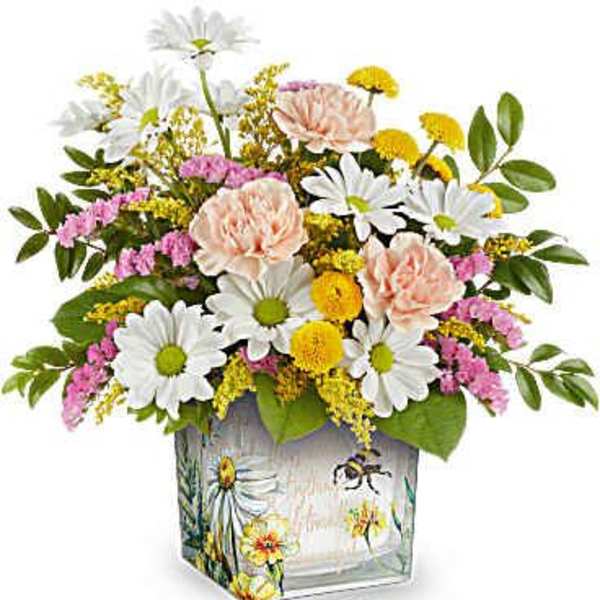 Mixed bouquet of daisies, carnations, and yellow filler in a painted glass vase