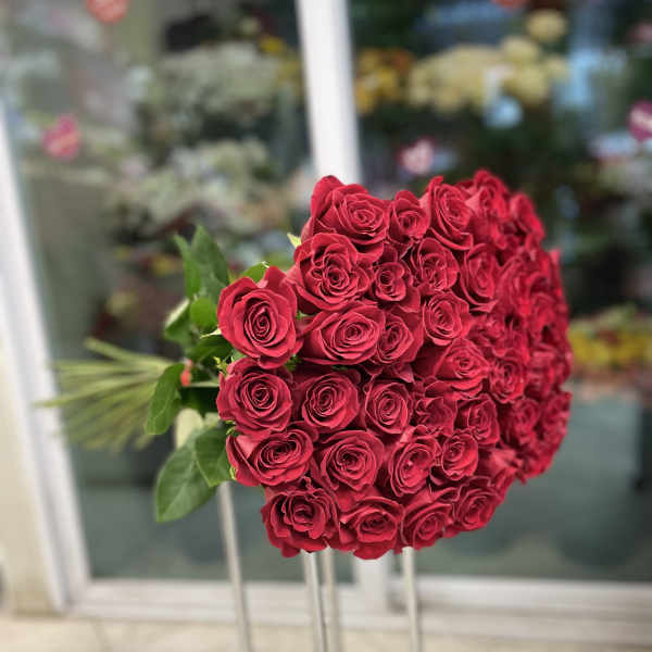 50 red roses bouquet. The photo shows a standard size.