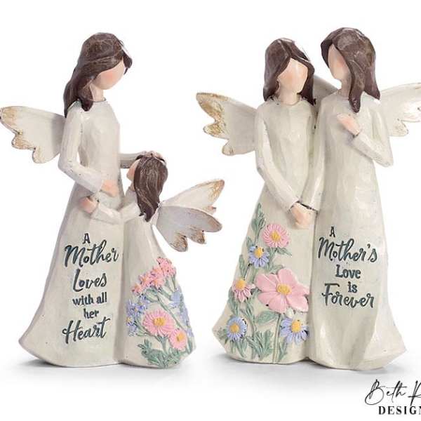 Two angel mother-and-child figurines with engraved sayings and pastel flower details on their dresses.