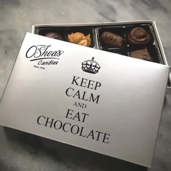Box of assorted chocolates with a printed lid