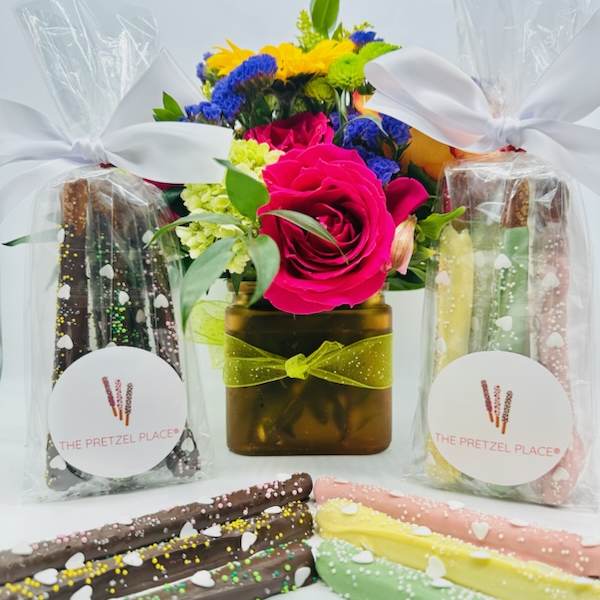 Flower arrangement with pretzel gift bags and chocolate-covered pretzel rods
