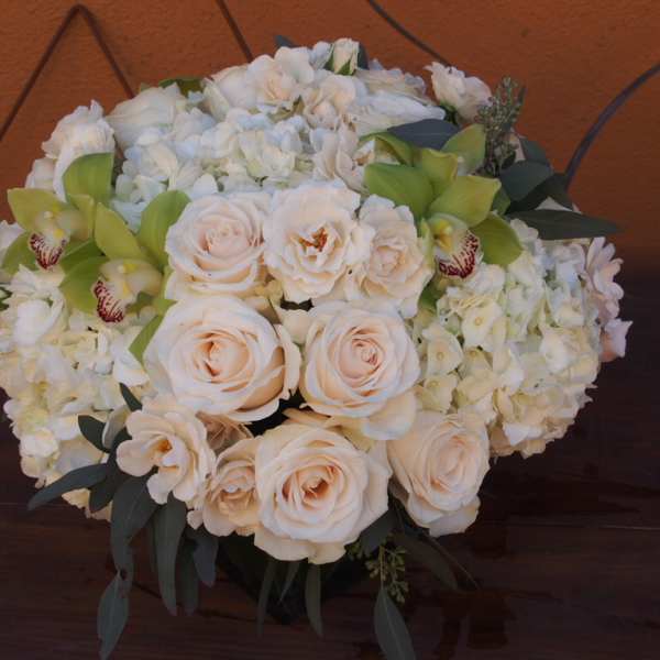 Cream rose and white hydrangea bouquet with green orchids