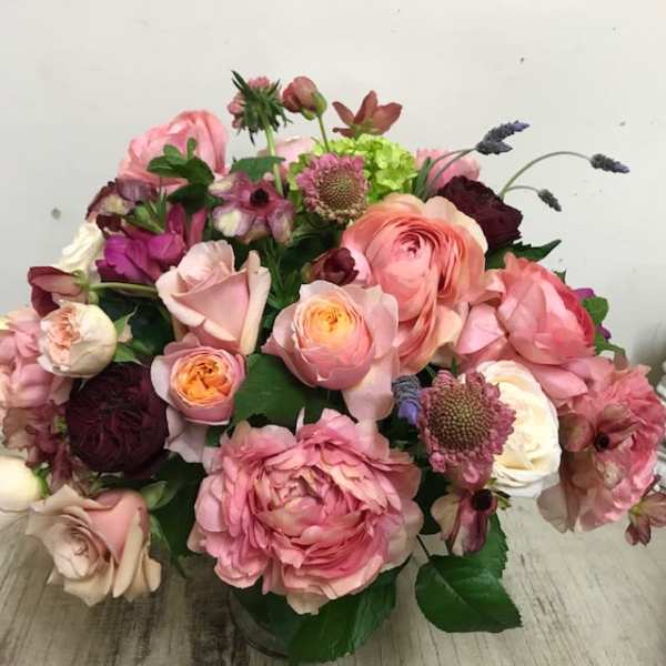 Bouquet of pink and burgundy flowers in a vase