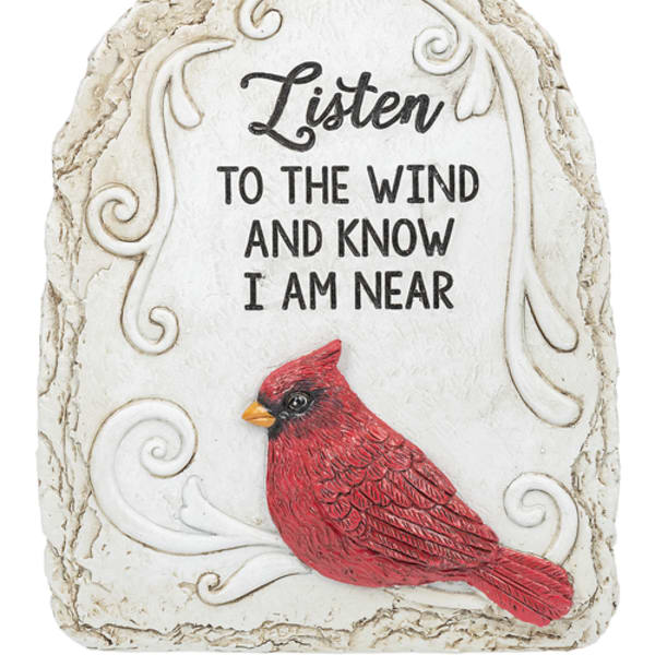 Decorative stone plaque with a red cardinal and memorial text