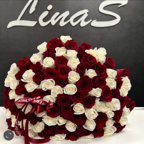 Large bouquet of red and white roses with a ribbon