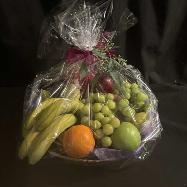 Wrapped fruit basket with bananas, grapes, and citrus