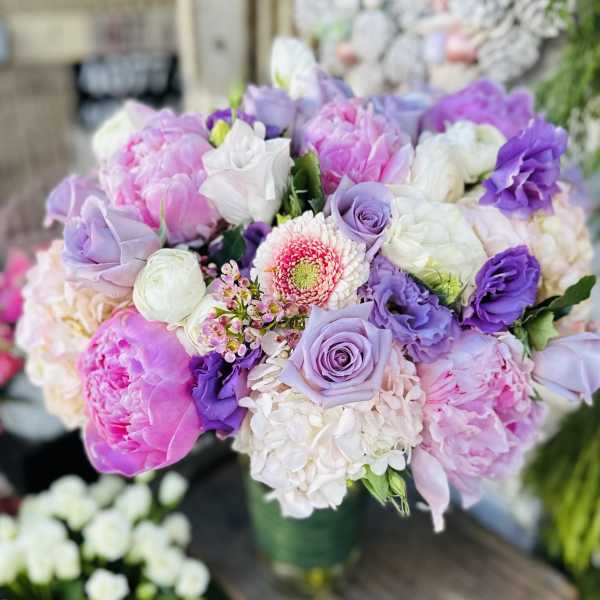 Bouquet of pink, lavender, and white flowers in a vase