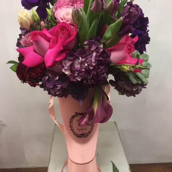 Bouquet of pink and purple flowers in a pink wrap