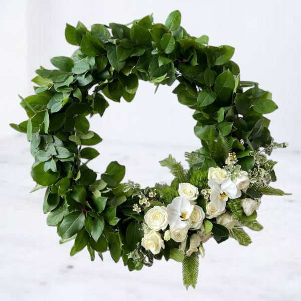 Green floral wreath with white roses and orchids
