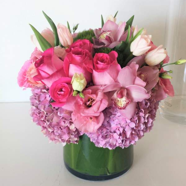 Pink and lavender bouquet in a glass vase