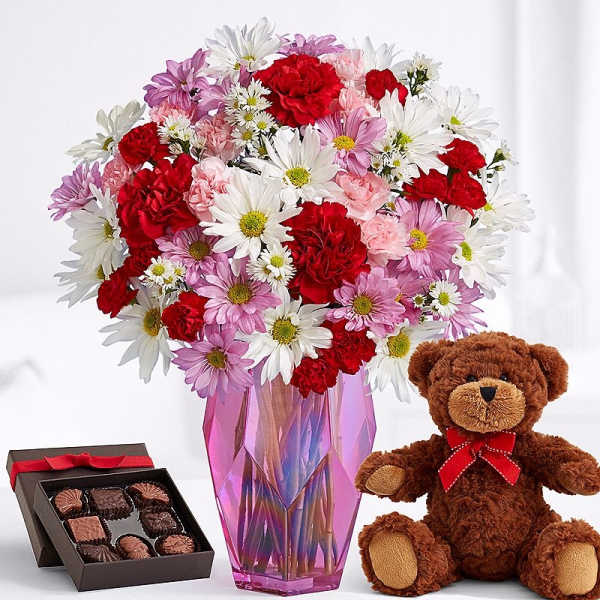 Mixed bouquet in a pink vase with a teddy bear and chocolate box