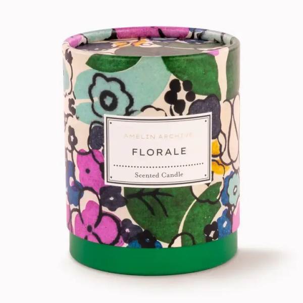 Floral-patterned scented candle in a cylindrical container