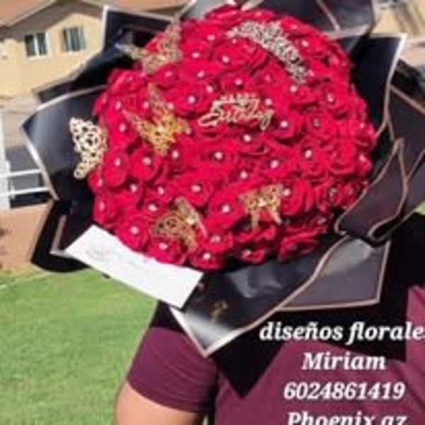 Large bouquet of red roses wrapped in black paper