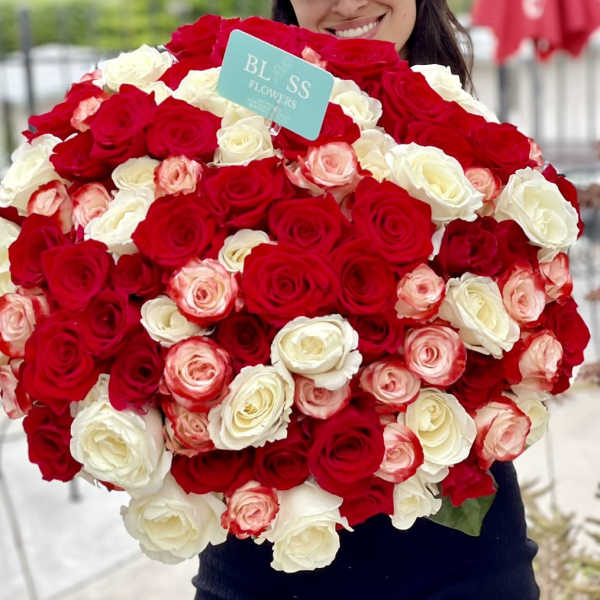 Large bouquet of red, white, and pink roses
