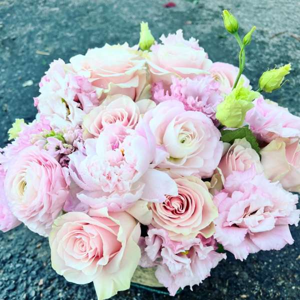 Bouquet of pale pink roses and ruffled pink flowers