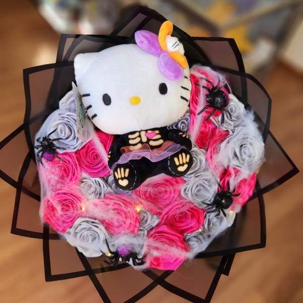 Hello Kitty plush bouquet with pink and gray rosettes and spider decorations