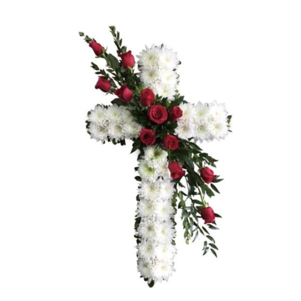 Cross-shaped floral tribute with red roses and white chrysanthemums