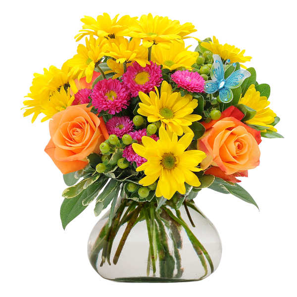 Bright bouquet of yellow daisies, pink blooms, and orange roses in a round glass vase with a blue butterfly pick