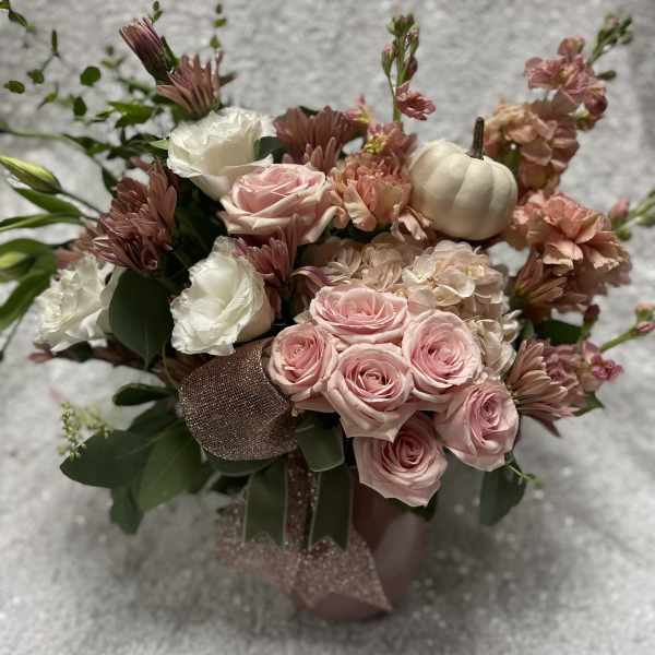 Pink and white rose bouquet with mums and a small white pumpkin