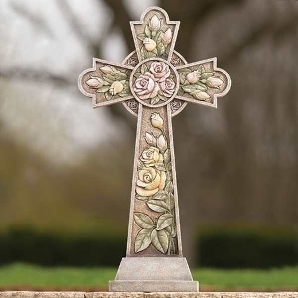 Decorative stone cross with carved roses and buds