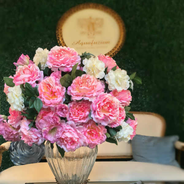 Pink and white flower arrangement in a glass vase