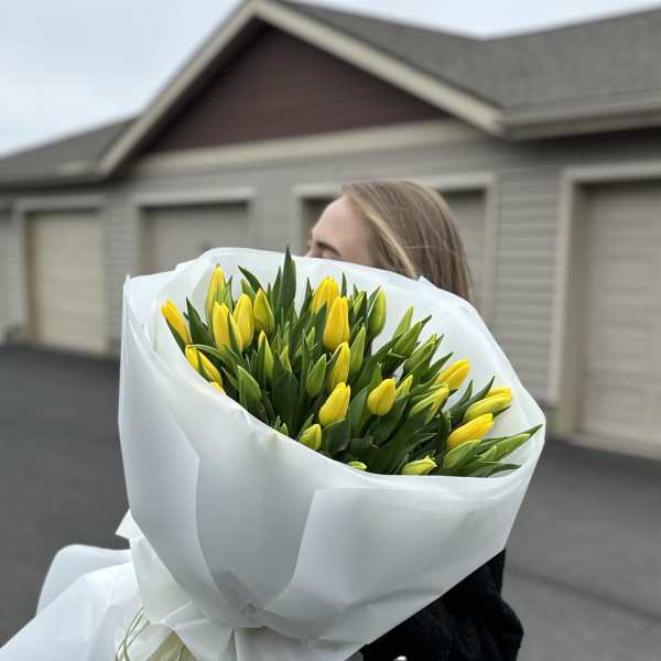 a bouquet of forty delicate yellow tulips