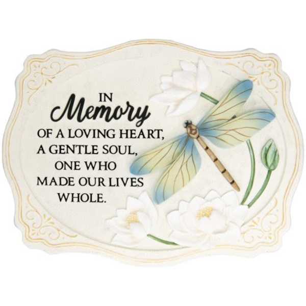 Memorial plaque with dragonfly and white flowers