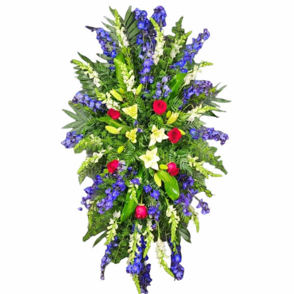 Tall standing floral spray with blue, white, and red flowers