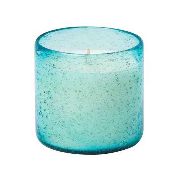 Blue glass candle holder with a single wick