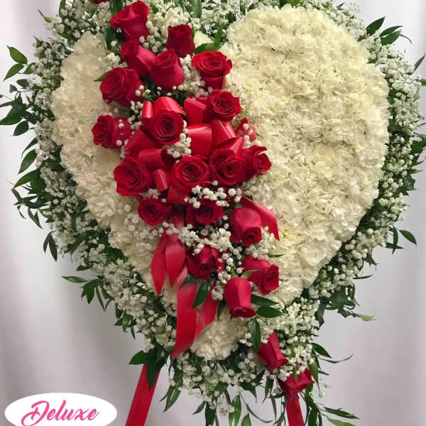 Heart-shaped floral spray with red roses and white flowers
