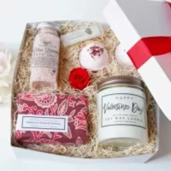Gift box with a candle, soap, lotion, and bath items