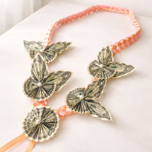 Money lei with delicate dollar flowers