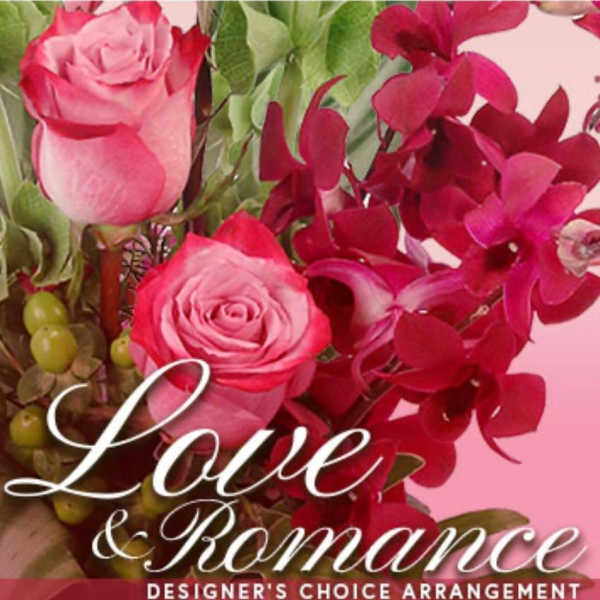 Pink roses with deep red orchids and greenery