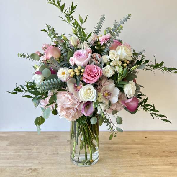 Pink and white mixed bouquet in a clear glass vase