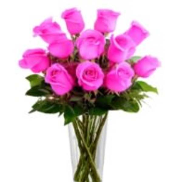 Tall clear vase filled with long-stem hot pink roses