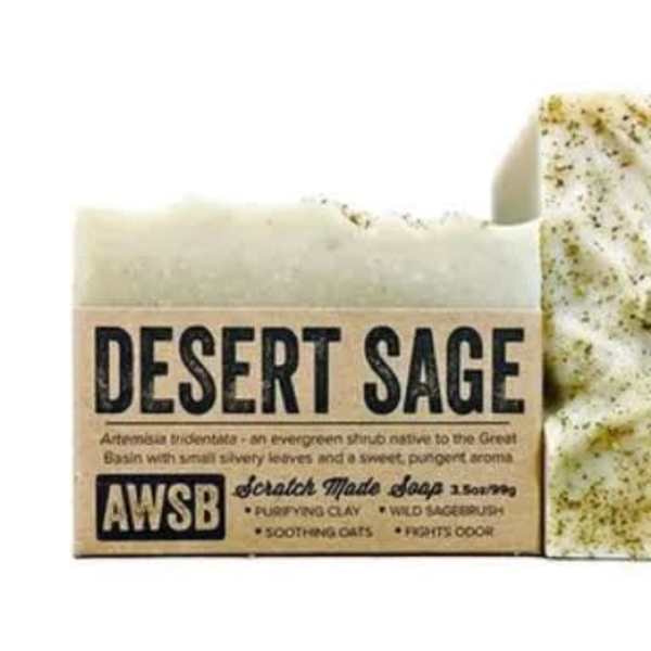 Rectangular bar of speckled desert sage soap wrapped in a kraft paper label
