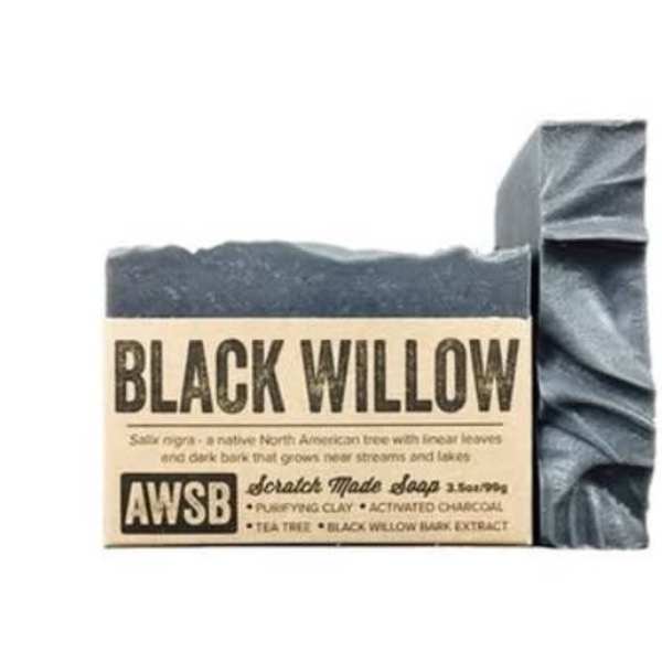 Dark charcoal bar soap with textured top and kraft paper label reading Black Willow.
