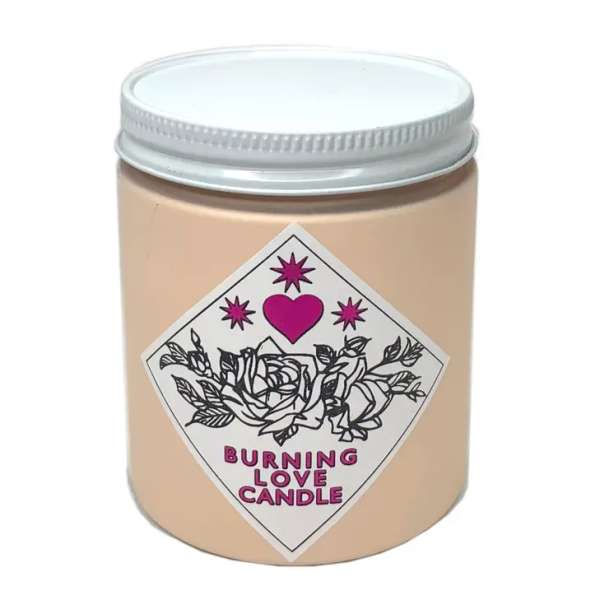 Beige candle in a glass jar with a pink heart label