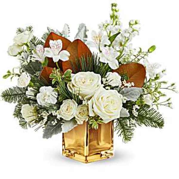 White roses and orchids in a gold vase with greenery
