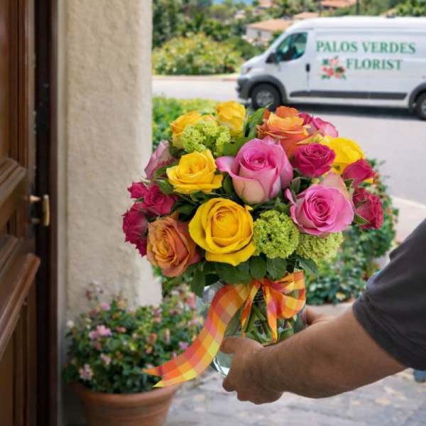 Bouquet of multicolored roses with a plaid ribbon