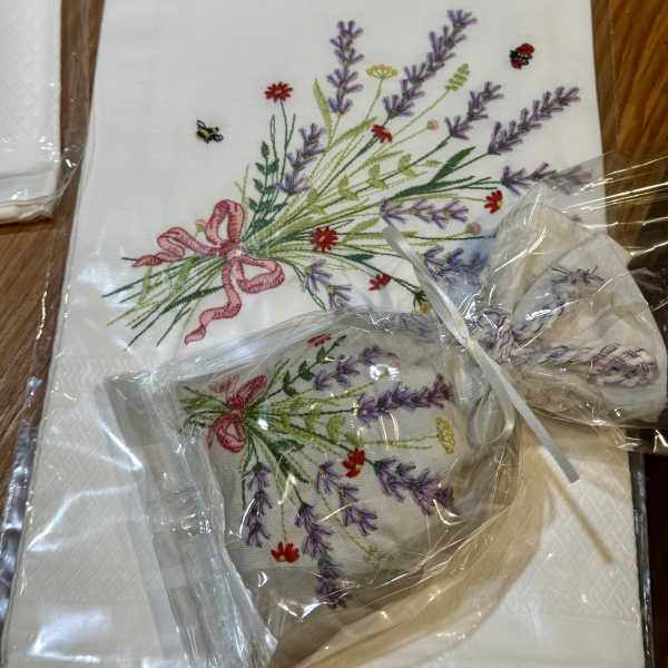 Embroidered floral napkins with lavender and pink ribbon bows