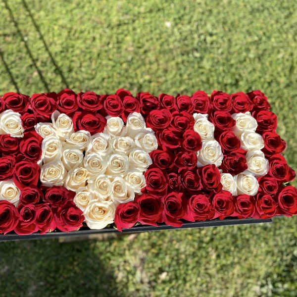 Rectangular arrangement of red and white roses