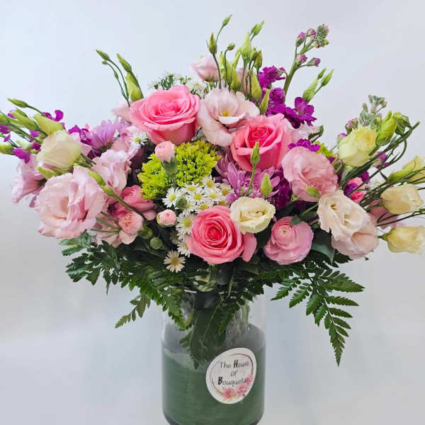 Mixed pink and purple bouquet in a glass vase