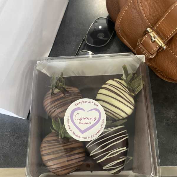Box of chocolate-covered strawberries in a clear plastic container