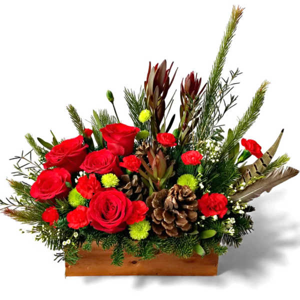 Red roses and pinecones in a wooden box with evergreen accents