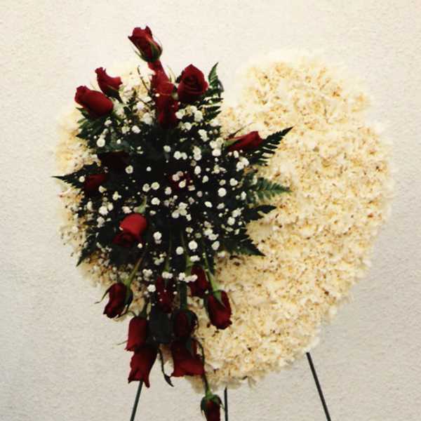 Red roses and white baby's breath on a standing spray