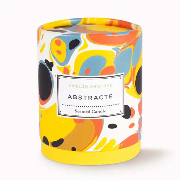 Abstract patterned scented candle in a cylindrical container