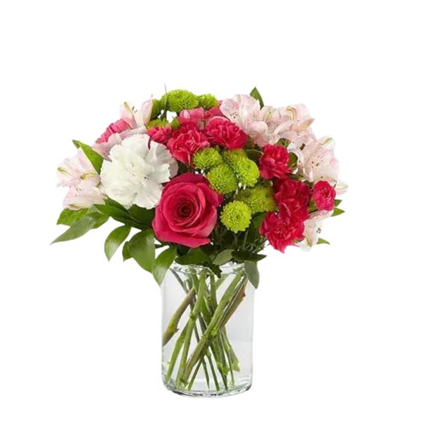 Bouquet of pink and white flowers in a clear glass vase