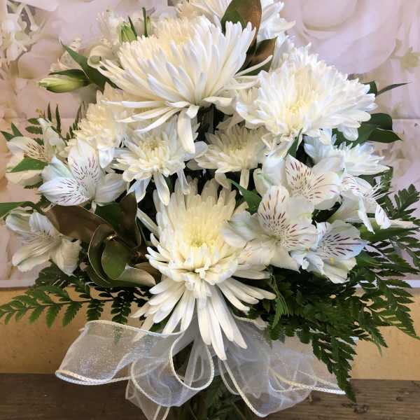White chrysanthemum bouquet with alstroemeria in a glass vase